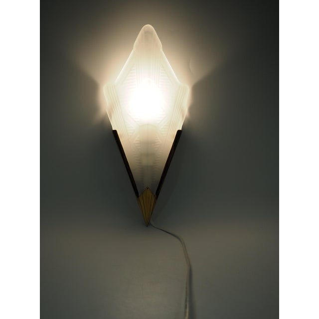 Pair of ikea v9120 wall lamps in frosted glass and brass mid-1990s. this stylish pair of brass wall lamps from ikea is a...