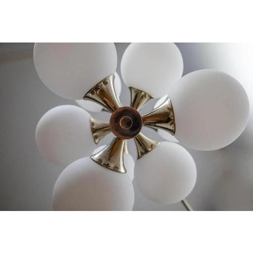 This amazing pair of chrome chandelier with 9 white opal glass globes each is a rare find. The 9 globes decorating the...