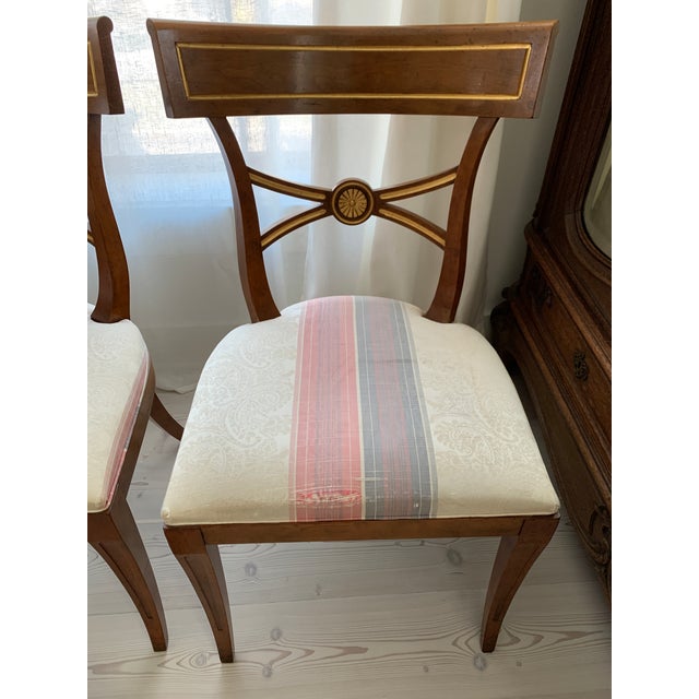 Absolutely sublime set of vintage Baker Furniture English Regency Klismos style dining chairs. Such a classic style, this...