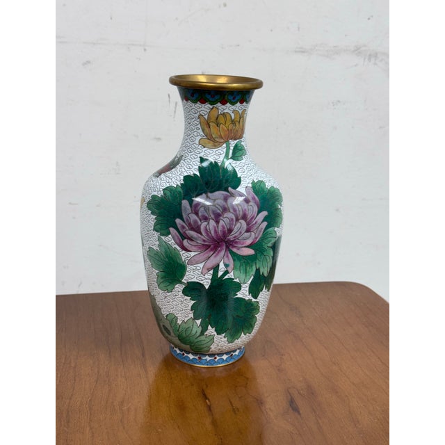 Design Plus Gallery presents a Chinese Enamel Cloisonné Vase With Flowers. This vase was made by using a centuries-old...