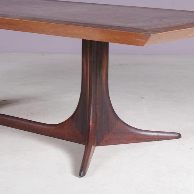 A large, warm wooden coffee table, manufactured in Denmark around 1960. This beautiful table is made of high quality oiled...