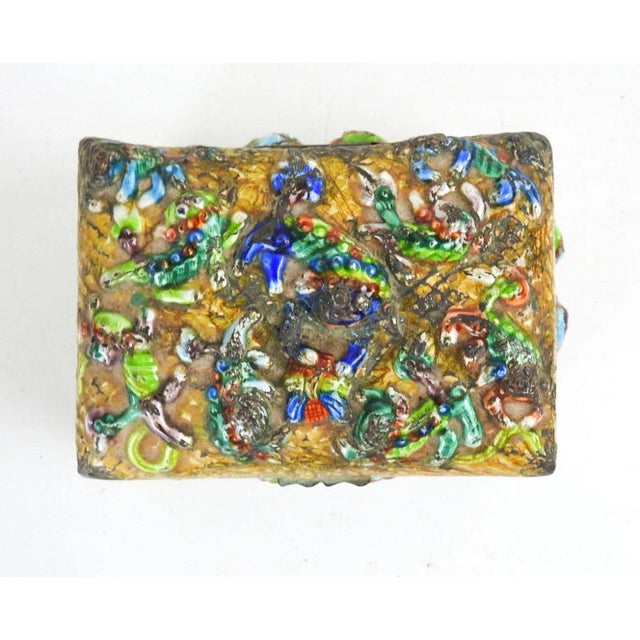 Vintage early 20th century distressed repousse enamel on copper trinket box. Marked China on bottom, decorated with...