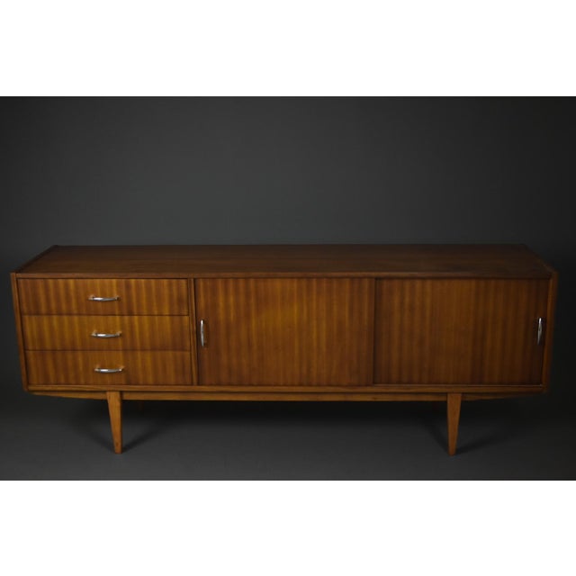 This elegant mid-century sideboard, known as "Violetta, " was manufactured in Poland in the 1960s. It features distinctive...