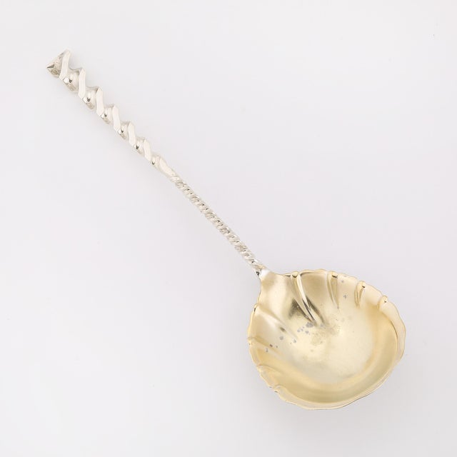 This Arts and Crafts Movement Sterling Silver & Gold Washed Square Twist Serving Spoon, signed by Whiting Manufacturing...