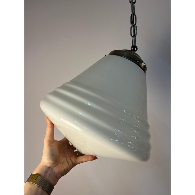 The philite pendant lamp from philips is an impressive product of the art deco era, captivating with its typical...