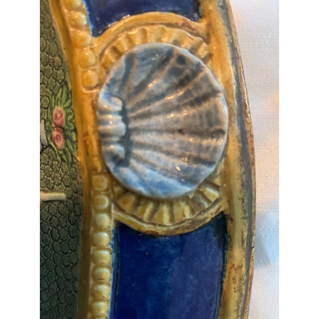 French Faience decorative plate entitled “Un Repas Au XVI S” with dining scene in bas-relief. a beautiful plate with...