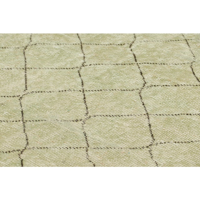 Hand-knotted in wool and originating from Turkey circa 1960 – 1970, this 3x6 vintage Zeki Müren runner is a unique...