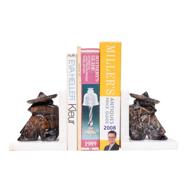 very nice set of Bookends . White Marble base comes with carved Mexican with sombreros. In a typical siesta pose very good...
