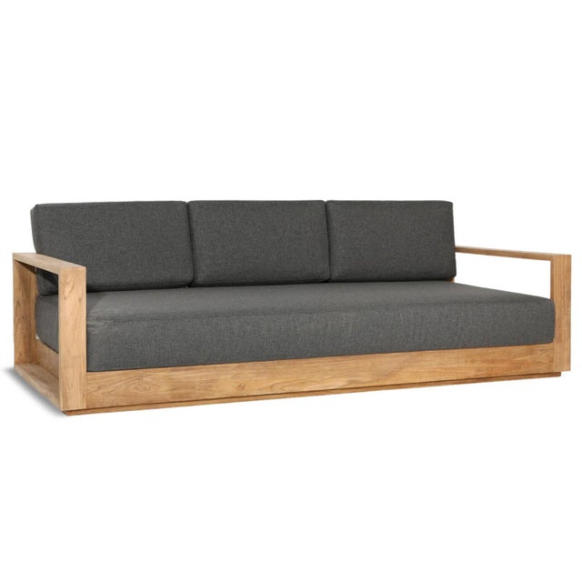 Outdoor teak wood frame sofa. Charcoal gray solution-dyed acrylic upholstered cushions. Simple modern design which will...