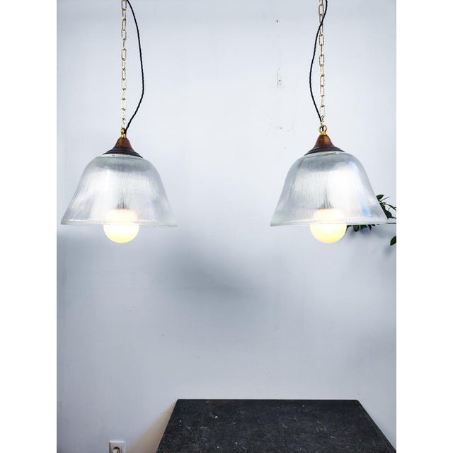 Beautiful large dome shaped prismatic glass Holophane pendant lights with translucent opaline globes. The galeries are...