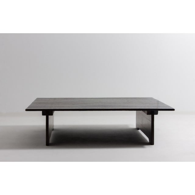 This large square Brutalist coffee table from the 1980s is made from heavy, rugged wood with a strong grain and dark...