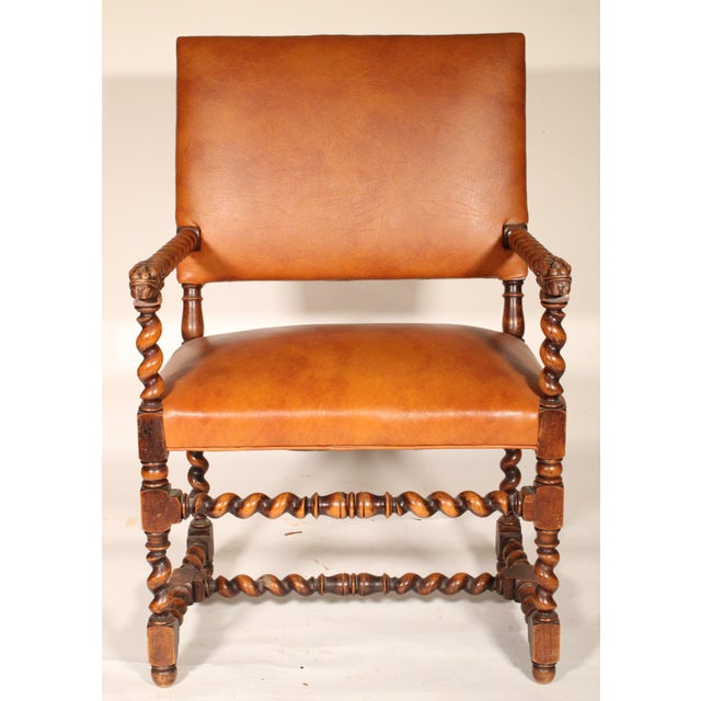 Pair of baroque style oak barley twist armchairs with leatherette upholstery, circa 1910. With leatherette upholstered...
