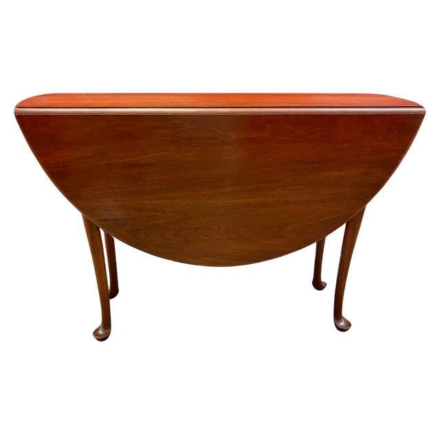 Versatile vintage American Queen Anne-style mahogany drop-leaf table, circa 1930s–1940s, designed to function as a slim...
