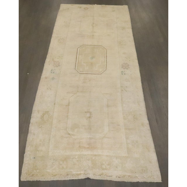 A vintage Turkish oushak neutral color gallery rug Measures: 4'8'' x 12'4''.