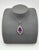 This striking Le Vian pendant showcases a magnificent 12.0 carat pear-cut amethyst, radiating a rich purple hue. The...