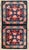 Hand-knotted wool rug measuring 2'0" x 3'10" (24" x 46"), featuring two stacked medallion panels with geometric and...