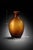 Sculptural amber glass vase with a distinctive flattened profile—warm, modern, and perfect for coastal, organic, and...
