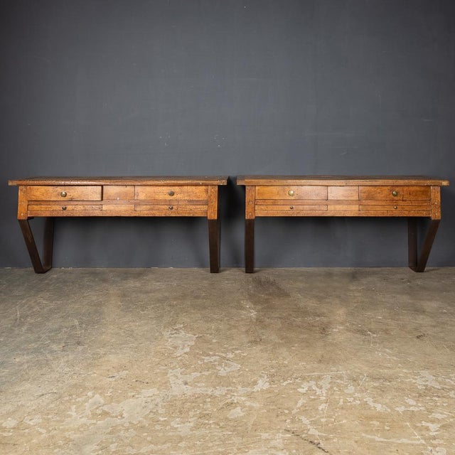 Antique 20th Century French pair of jewellery makers work benches, in walnut with four drawers and a supporting metal...