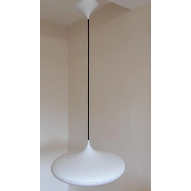 Vintage Ufo Ceiling Lamp in White Plastic with Black Fabric Cable from Phillips, 1990s, in Very Good conditions. Designed...