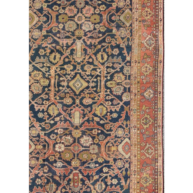 Antique Persian Sultanabad Gallery Rug with All over Design in Blue Background. This Antique Sultanabad displays a...