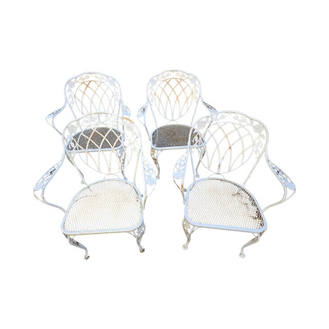Vintage Wrought Iron Outdoor Patio Dining chairs available now and ready to ship. Beautiful floral motif details along...