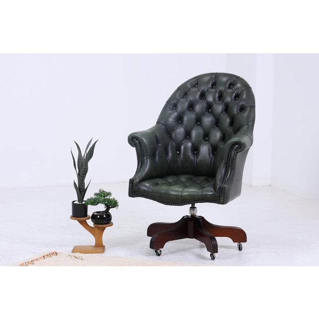 Beautiful Chesterfield leather armchair with casters. Item no.: 06-47. FEATURES - Timeless vintage design - Style: Mid...