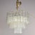 Found in Italy, this six light, three tiered glass fixture dates from the 1960s. Metal frame supports three tiers of tube-...