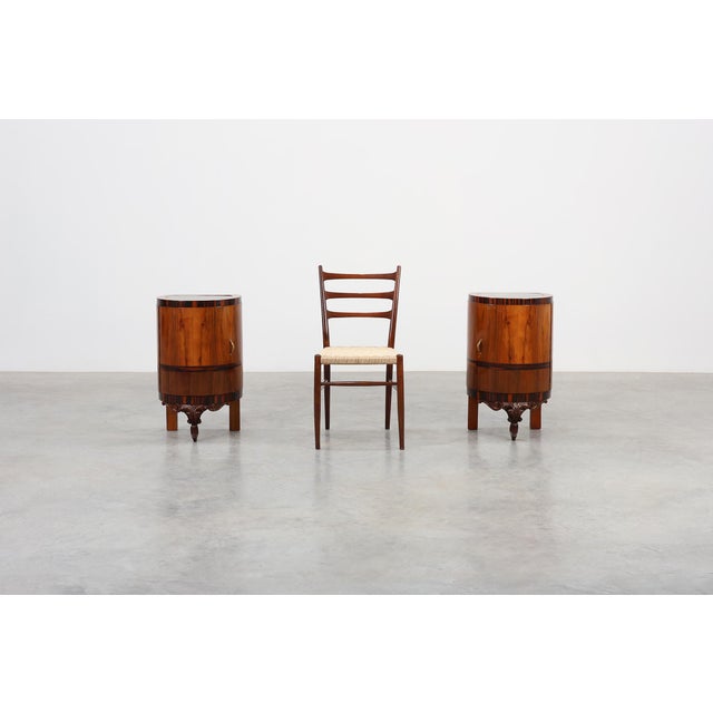 A sophisticated pair of Italian Art Deco nightstands from the 1920s, crafted in beautifully figured walnut and topped with...