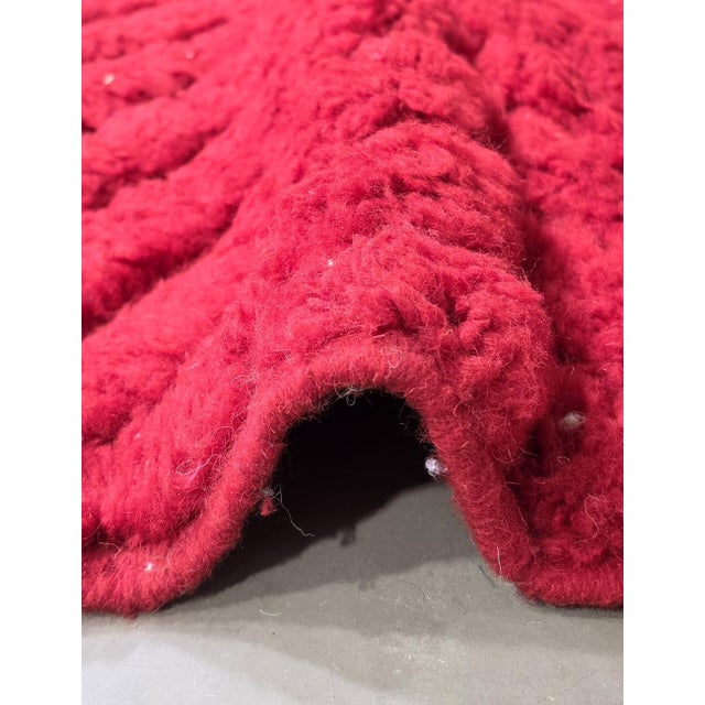 Red Moroccan Rug – Handmade Textured Berber Wool Carpet This bold handmade Moroccan rug features a rich red wool field...