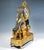 Excellent fire-gilded Empire bronze mantel clock: structure in the form of a rectangular, stepped pedestal that tapers at...