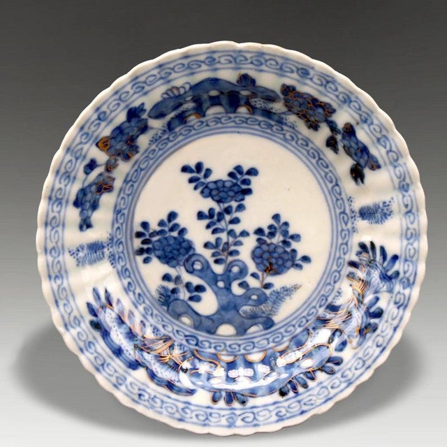 An attractive Chinese Kangxi-period fluted porcelain dish dating to the late 17th or early 18th century, circa 1700....