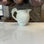 A charming vintage Wedgwood cream pitcher in the classic Queensware ivory glaze, featuring a beautifully molded fox...