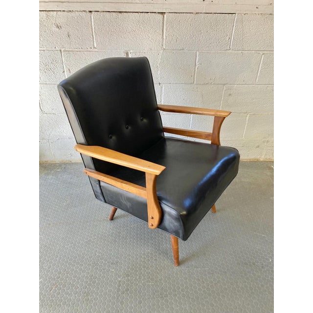 Vintage mid century accent chair We believe the chair is vinyl with maple arms and legs — very comfortable, classic mid...