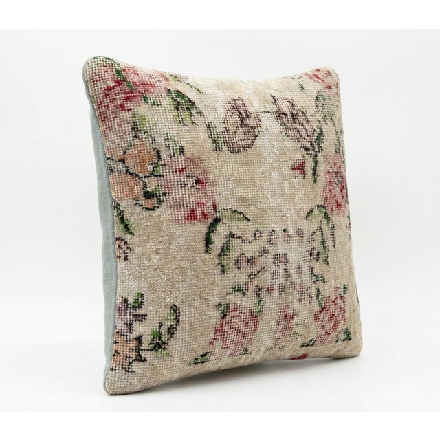 This beautiful 19'' x 19'' pillow cover was made from an authentic Turkish rug. Bright colors of wool adorn the front of...