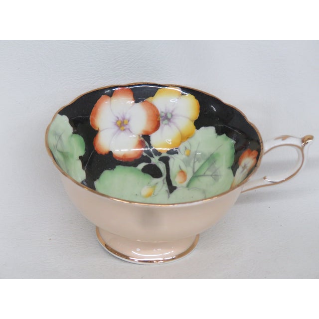 This stunning Paragon bone china coffee cup / tea cup was produced in the 1940s. The inside of the cup features a black...