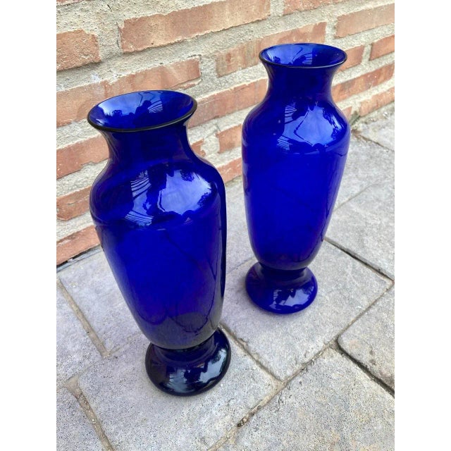 Colorful pair of midcentury cobalt blue vases of Murano, Italy, circa 1970s-1990s. Particularly striking is the narrow...