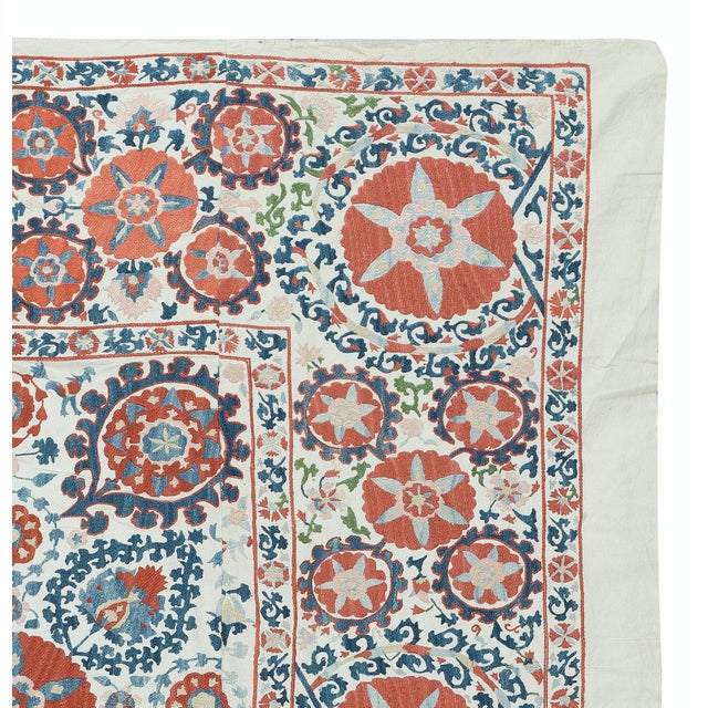 Introducing our exquisite new suzani hand embroidered wall hanging, a captivating piece that combines ancient...