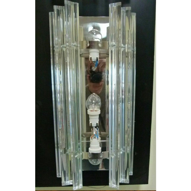 Pair of Murano wall sconces with hand-pulled slats; the two central slats move to change the bulbs, while the others are...