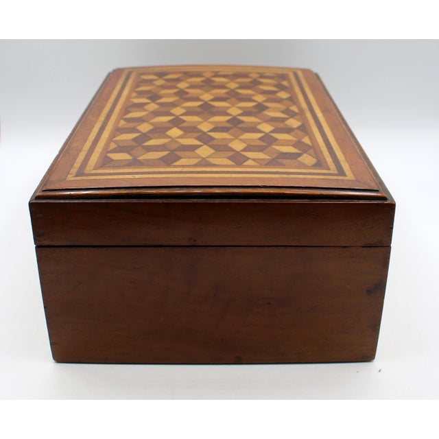 Mid-late 19th century tumbling block top jewelry box. English. Various woods. The interior with mirror and lift out...