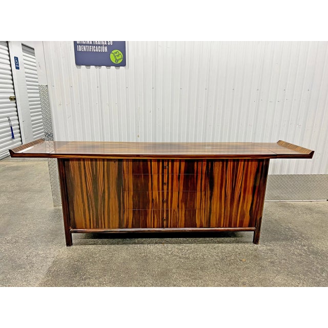Striking Mid Century Belgium Rosewood Credenza With Oriental Motif spold as found in original condition without restoration.