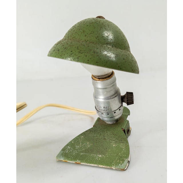 We are selling this really cool bedside clip reading light. This mid-century enamel metal piece has art deco styling and...