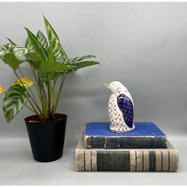 Adorable, 1980s Japanese porcelain penguin figurine from the Tapestry Collection by Action Industries, Inc. The whimsical...