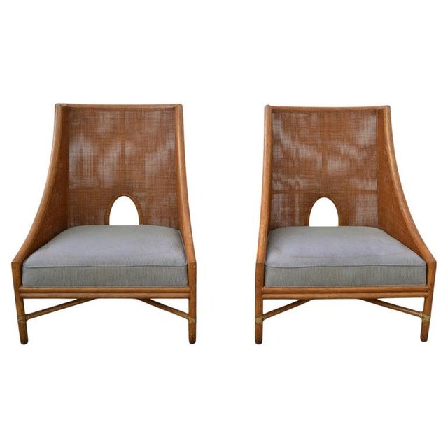 A Pair of fully restored large, caned Rattan Lounge Chairs designed by Barbara Barry and made in the USA by the McGuire...
