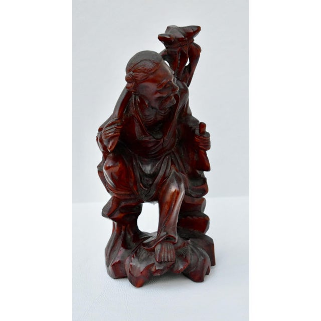 Vintage (1940's) Chinese Figure of a Wise man. Made of Wood. Rosewood. Carved. The Measurements: 4"W x 3.5"D x 8.5"H. Flat...