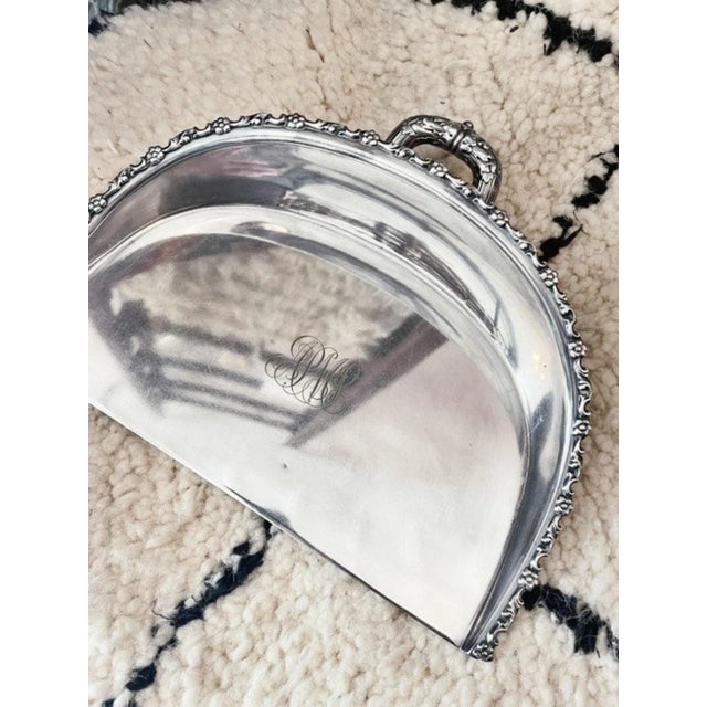 A seldom seen antique silver plated crumber dustpan made by Tiffany & Co. Clean crumbs off your table in style! In...