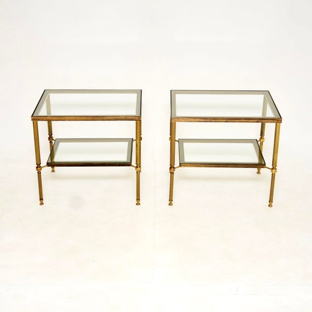 A superb pair of vintage French brass and glass side tables. They were made in France, and date from around the 1960’s....