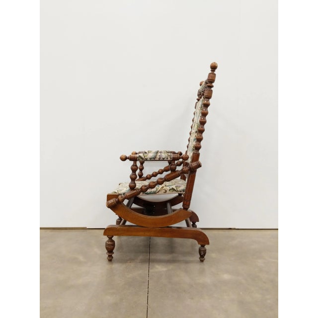 Authentic antique Danish rocking chair with foot stool. This chair is in excellent overall condition with few signs of...