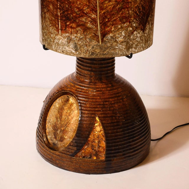 This striking Mid-Century Modernist ceramic floor/table lamp, crafted in France circa 1960, is a harmonious blend of...