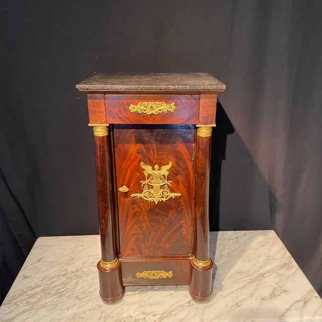 Beautiful mahogany French Empire ormolu mounted mahogany side cabinet, nightstand or side table with two interior shelves...