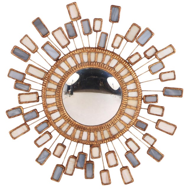A striking contemporary convex mirror inspired by the iconic Miroir Étincelles (“Sparks” or “Sparkles”) designs of Line...